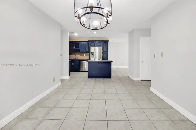 a kitchen with a stove and a refrigerator