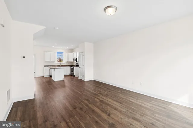 a view of kitchen with wooden floor