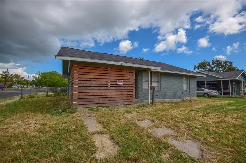 a backyard of a house with lots of green space