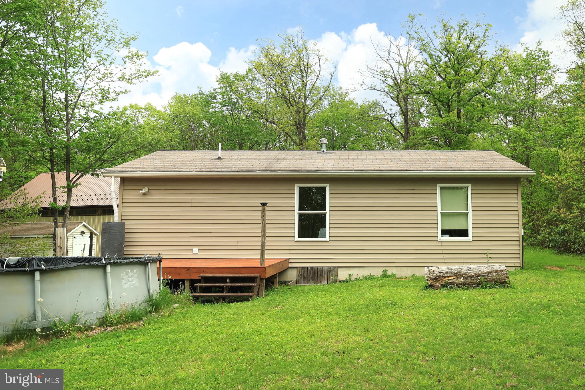 358 Buckridge Road Howard, PA 16841 - Photo 33 of 40 a backyard of a house with lots of green space
