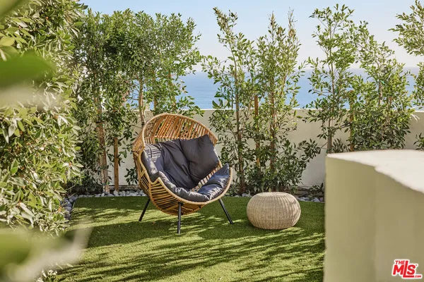 a view of a swimming pool with chairs