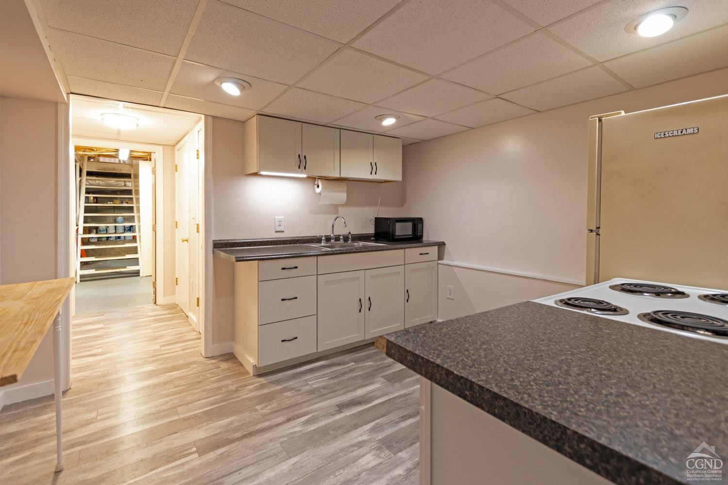 184 Snyderville Road Red Hook, NY 12571 - Photo 16 of 29 a kitchen with granite countertop a sink stainless steel appliances and cabinets