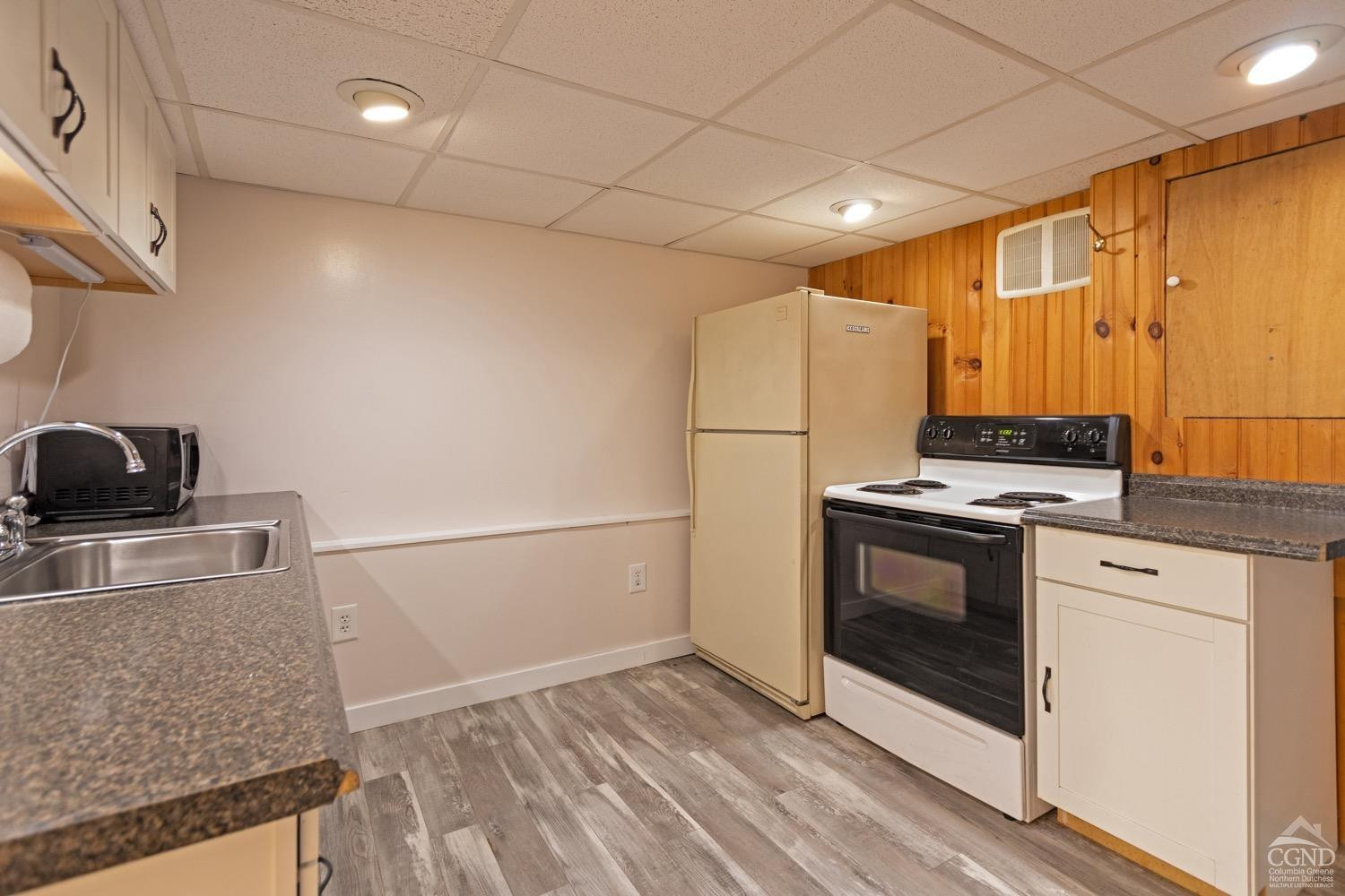 184 Snyderville Road Red Hook, NY 12571 - Photo 17 of 29 a kitchen with a stove and a refrigerator