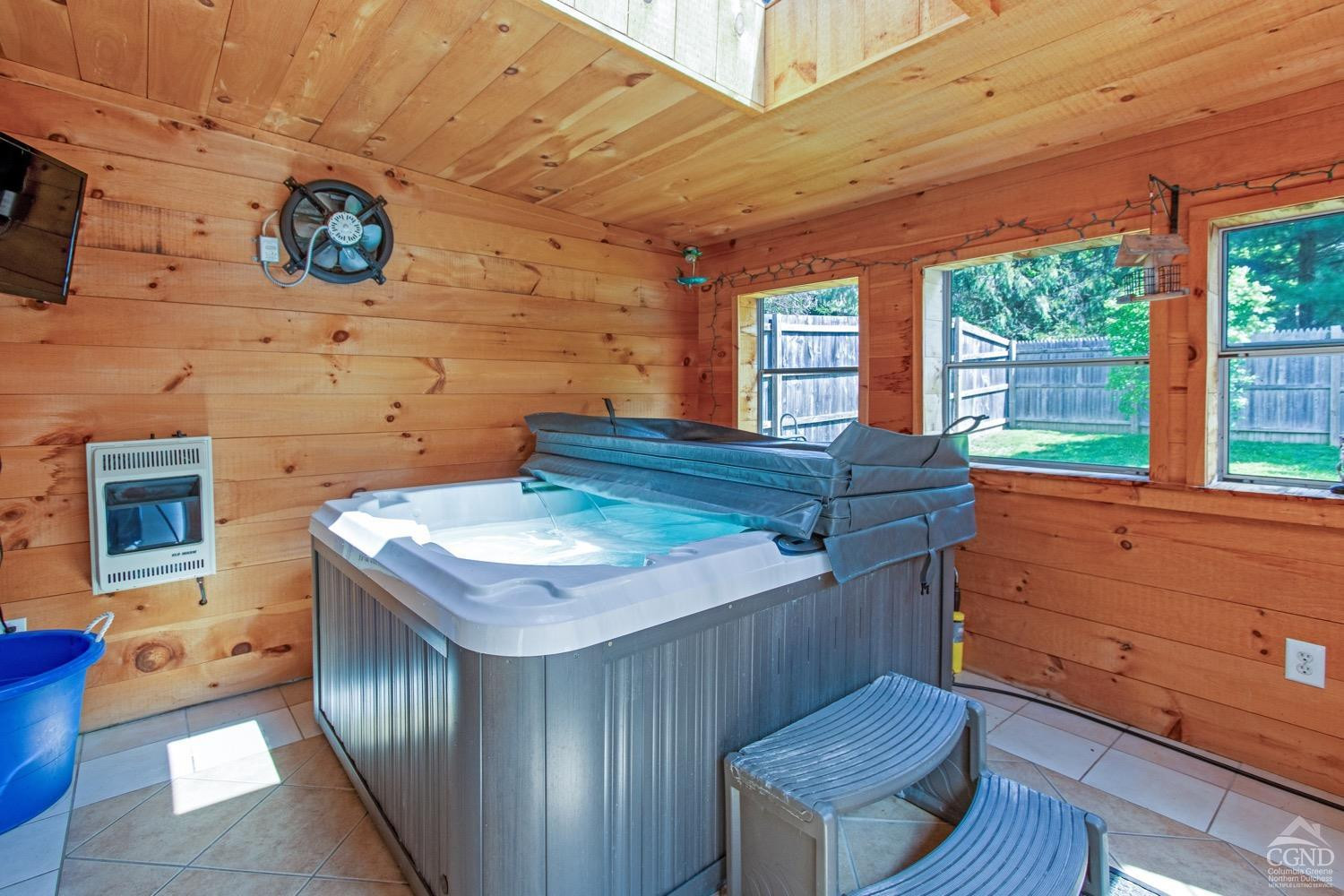184 Snyderville Road Red Hook, NY 12571 - Photo 19 of 29 a kitchen with a stove a refrigerator and wooden cabinets