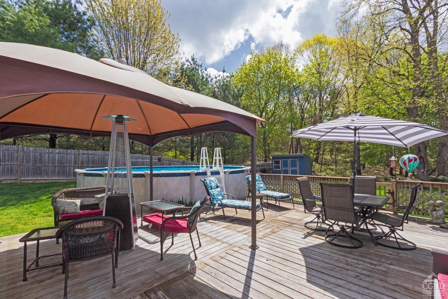 184 Snyderville Road Red Hook, NY 12571 - Photo 23 of 29 a view of backyard with outdoor seating and trees