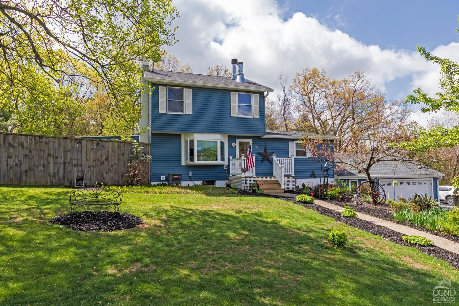 184 Snyderville Road Red Hook, NY 12571 - Photo 29 of 29 a view of a brick house with a big yard and large trees