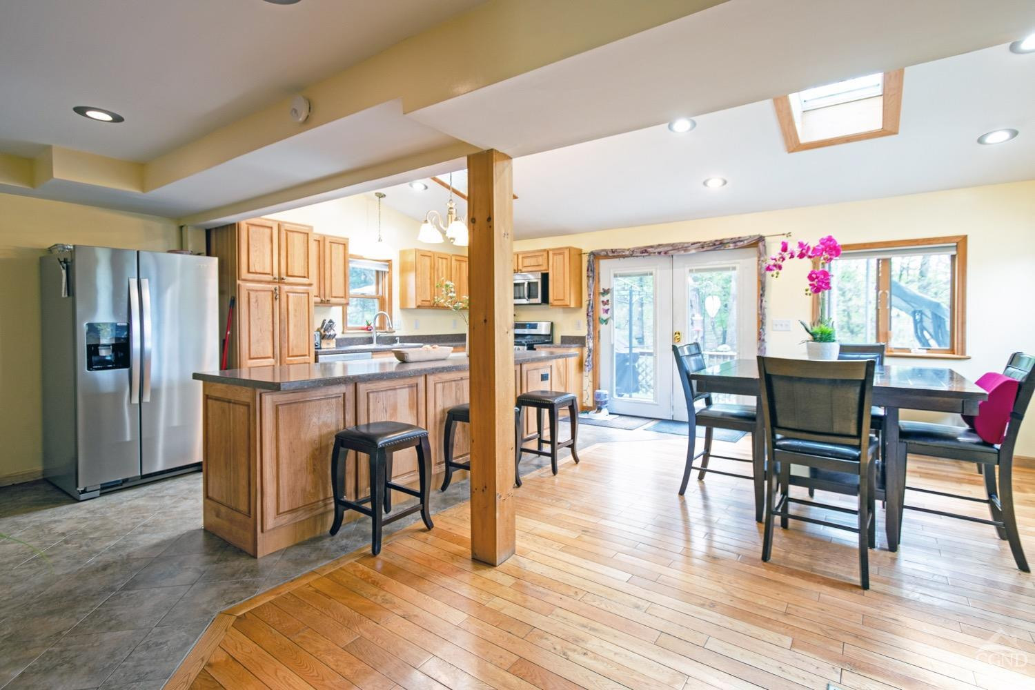 184 Snyderville Road Red Hook, NY 12571 - Photo 3 of 29 a dining hall with stainless steel appliances granite countertop a dining table and chairs with wooden floor