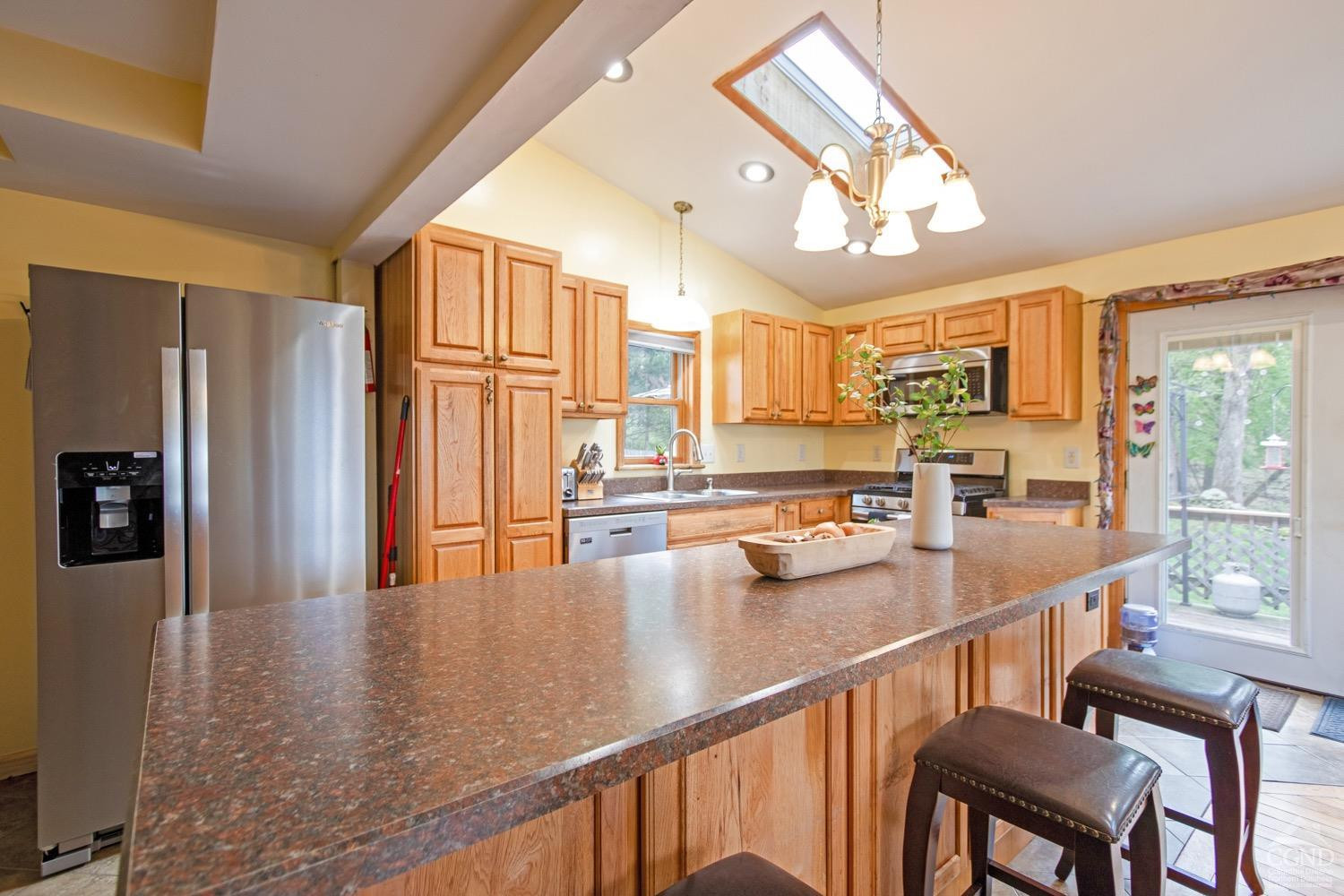 184 Snyderville Road Red Hook, NY 12571 - Photo 4 of 29 a kitchen with stainless steel appliances granite countertop a refrigerator a sink dishwasher and a stove with wooden floor