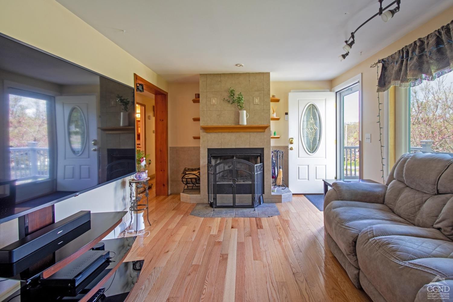 184 Snyderville Road Red Hook, NY 12571 - Photo 7 of 29 a living room with furniture and a fireplace