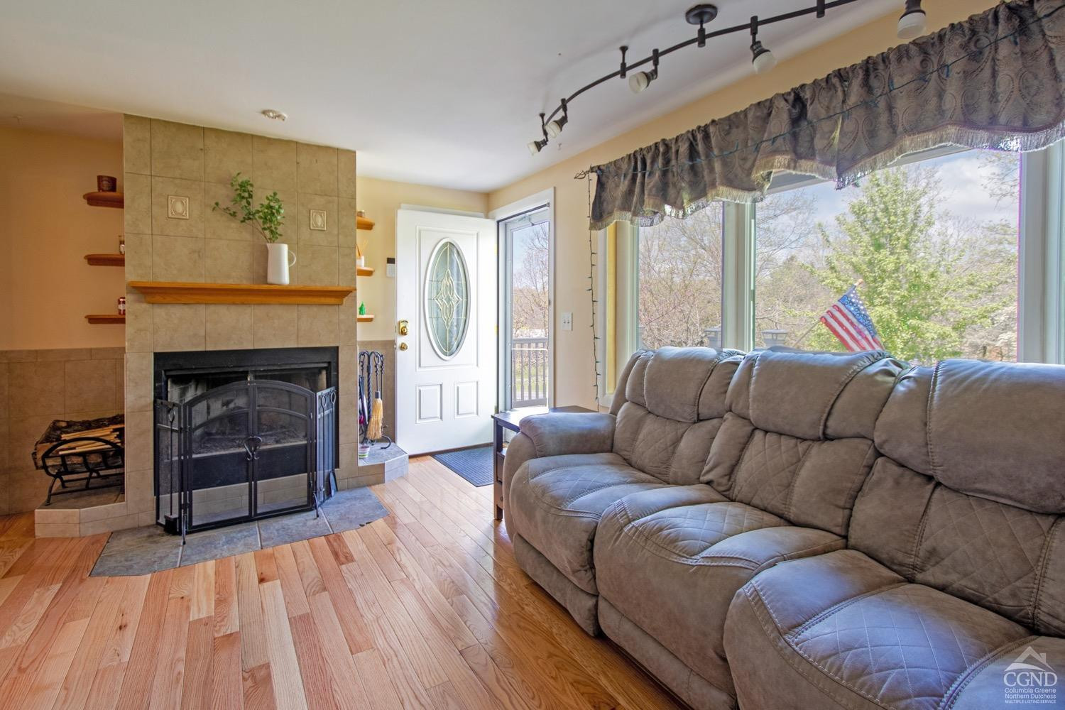 184 Snyderville Road Red Hook, NY 12571 - Photo 8 of 29 a living room with furniture and a fireplace