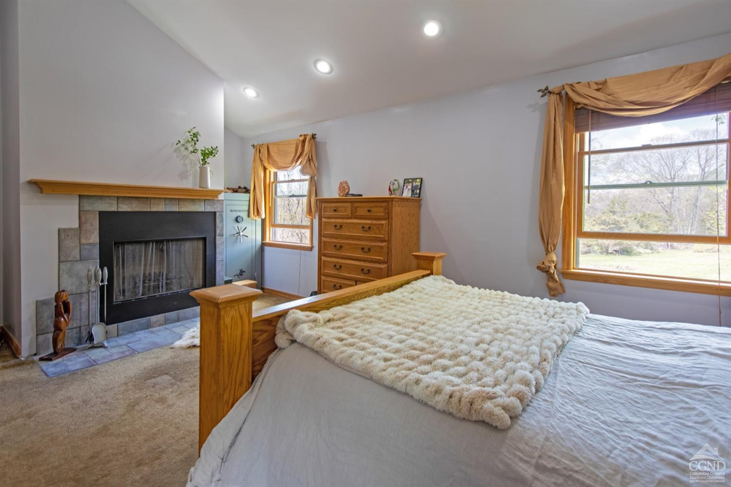 184 Snyderville Road Red Hook, NY 12571 - Photo 10 of 29 a bedroom with a bed and a fireplace