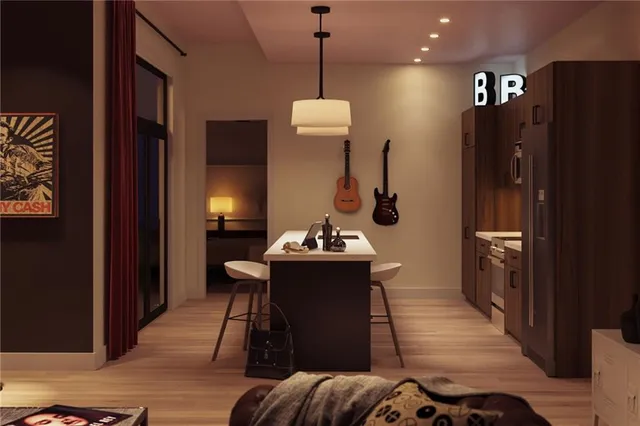 a living room with furniture and wooden floor