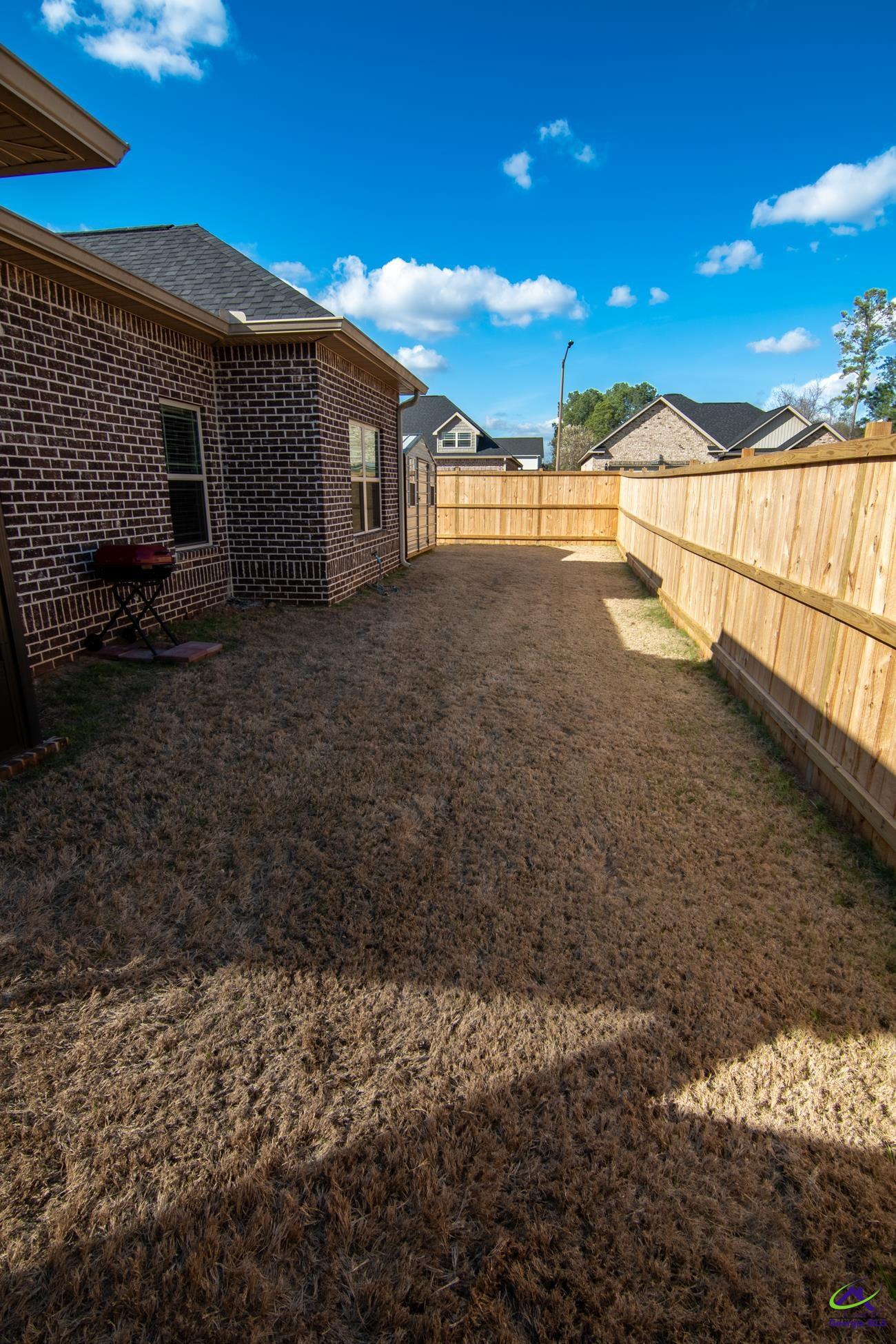 123 Logan's Mill Trail Warner Robins, GA 31093 - Photo 22 of 23 a view of a backyard with patio