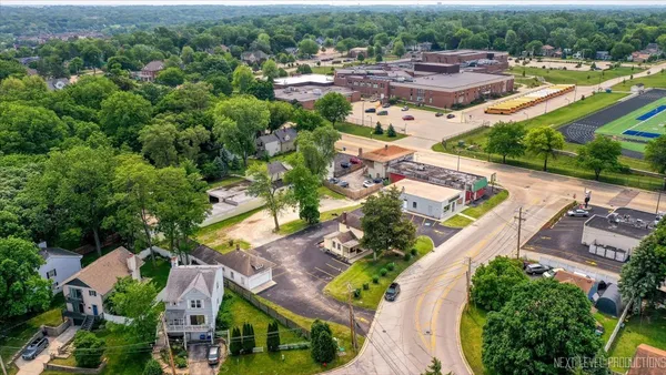 an aerial view of residential houses with outdoor space