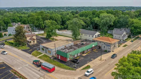 an aerial view of a chairs and table in the backyard
