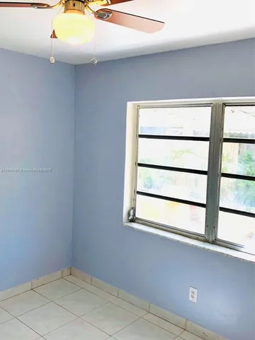 a view of kitchen with stainless steel appliances wooden floor