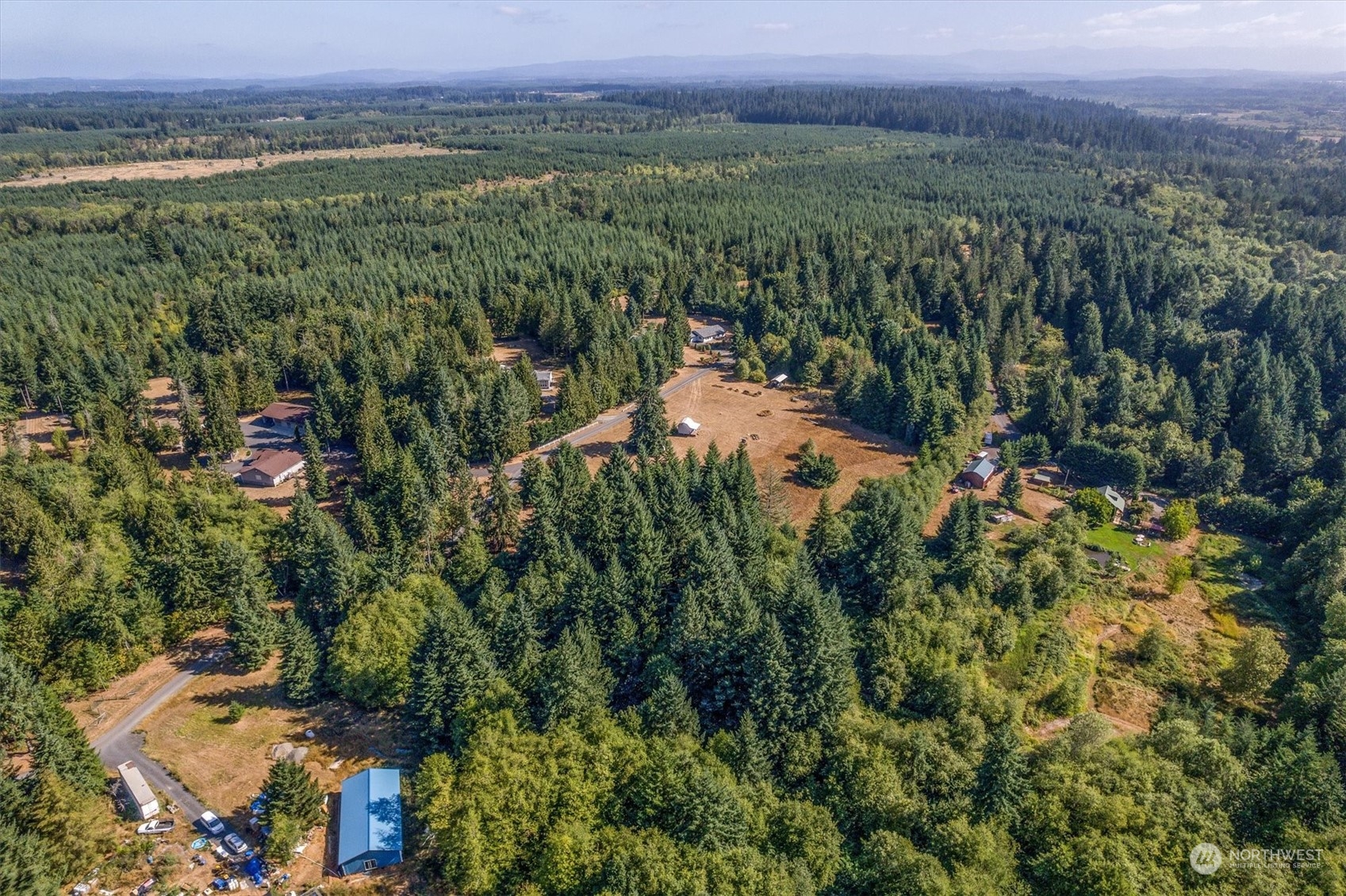 110-165 Rawlins Road Winlock, WA 98596 - Photo 18 of 21 an aerial view of a town with trees