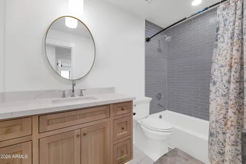 a bathroom with a double vanity sink mirror and