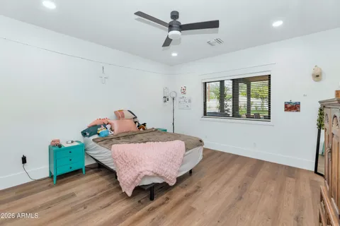 a bathroom with a sink a mirror and shower