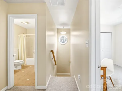 a view of a bathroom from a hallway