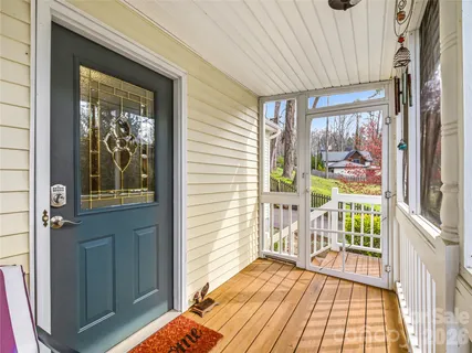 a view of a balcony with wooden floor