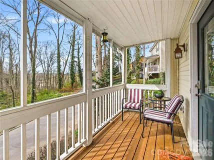 a view of a two chairs in the balcony