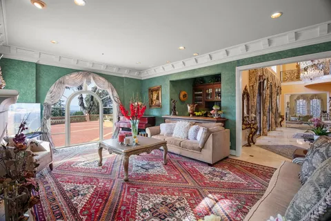 a bedroom with a bed window and couch