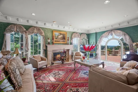 a view of a livingroom with furniture and a fireplace