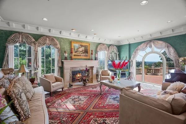 a view of a livingroom with furniture and a fireplace