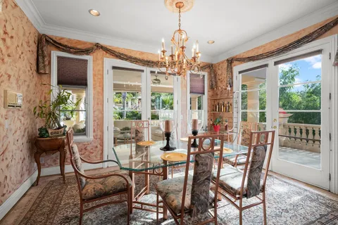 a bathroom with a granite countertop sink a mirror and shower