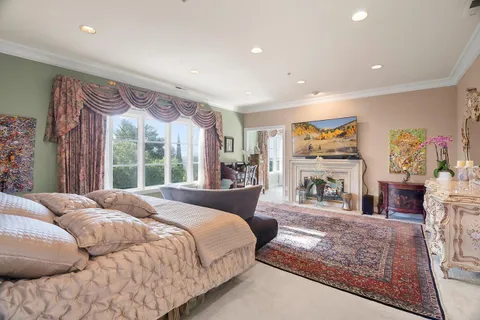 a bed room with a bed and a chair