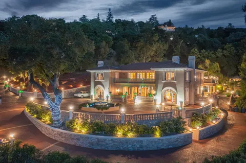 a view of a dining room with a table and chairs