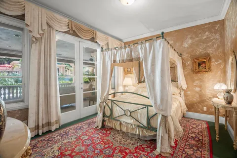 a view of a patio with table and chairs and potted plants