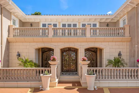 a view of an entryway with a table and chairs