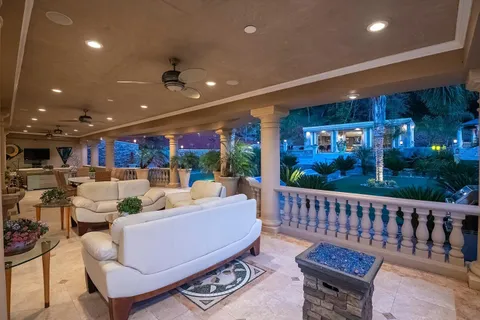 a view of a chairs and table in the terrace