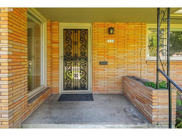 a view of outdoor space and front view of a house having outdoor