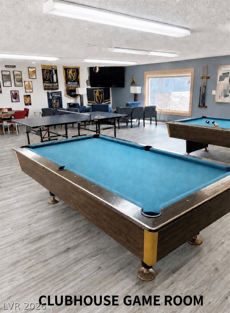4556 Royal Ridge Way Las Vegas, NV 89103 - Photo 32 of 49 Durable plank flooring and a large window enhance this versatile recreation space.