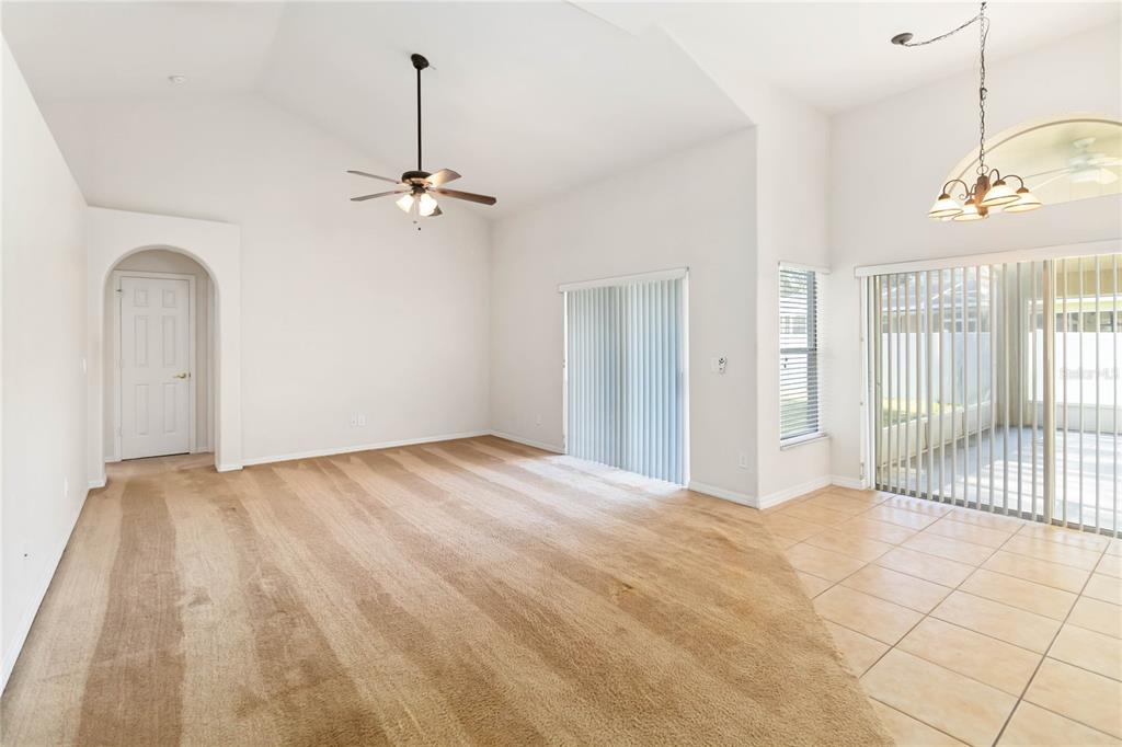 4136 Maidu Court St. Cloud, FL 34772 - Photo 14 of 40 a view of empty room with wooden floor and fan