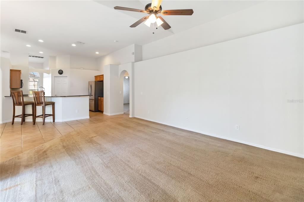 4136 Maidu Court St. Cloud, FL 34772 - Photo 16 of 40 a view of empty room with kitchen view and a window