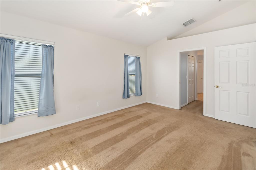 4136 Maidu Court St. Cloud, FL 34772 - Photo 18 of 40 an empty room with windows and closet