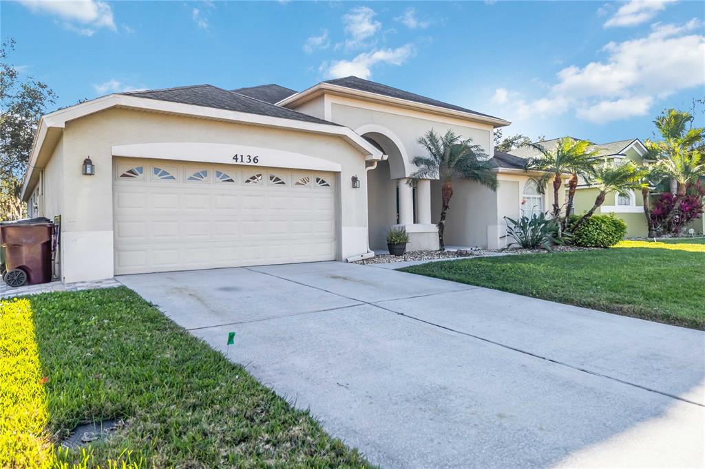 4136 Maidu Court St. Cloud, FL 34772 - Photo 2 of 40 a front view of house with yard