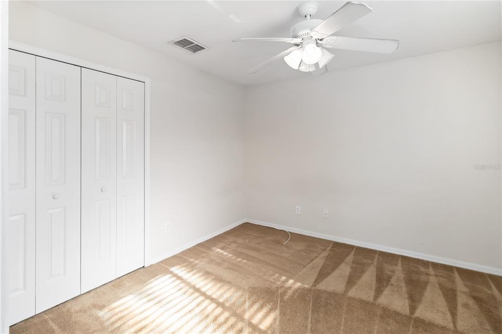 4136 Maidu Court St. Cloud, FL 34772 - Photo 22 of 40 a view of a room with a ceiling fan and a window