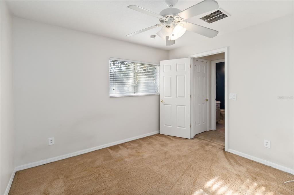 4136 Maidu Court St. Cloud, FL 34772 - Photo 23 of 40 an empty room with windows and fan