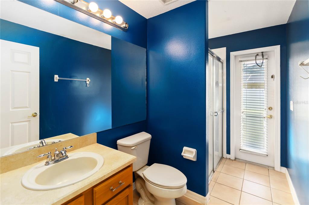 4136 Maidu Court St. Cloud, FL 34772 - Photo 24 of 40 a bathroom with a toilet a sink and a mirror