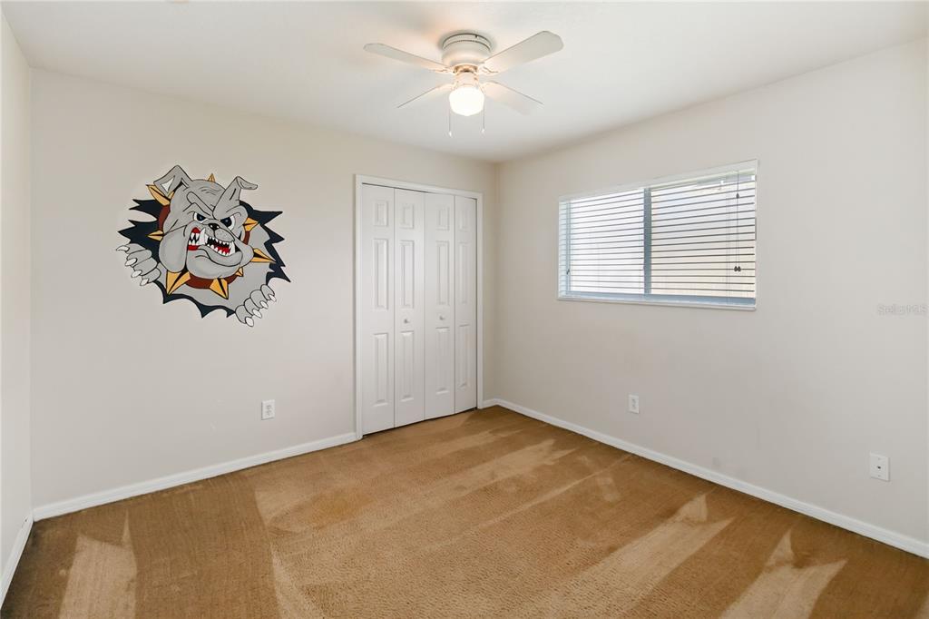 4136 Maidu Court St. Cloud, FL 34772 - Photo 26 of 40 an empty room with windows and fan