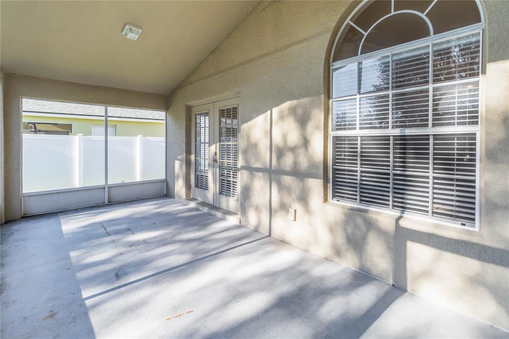 4136 Maidu Court St. Cloud, FL 34772 - Photo 30 of 40 a view of empty room with wooden floor and fan