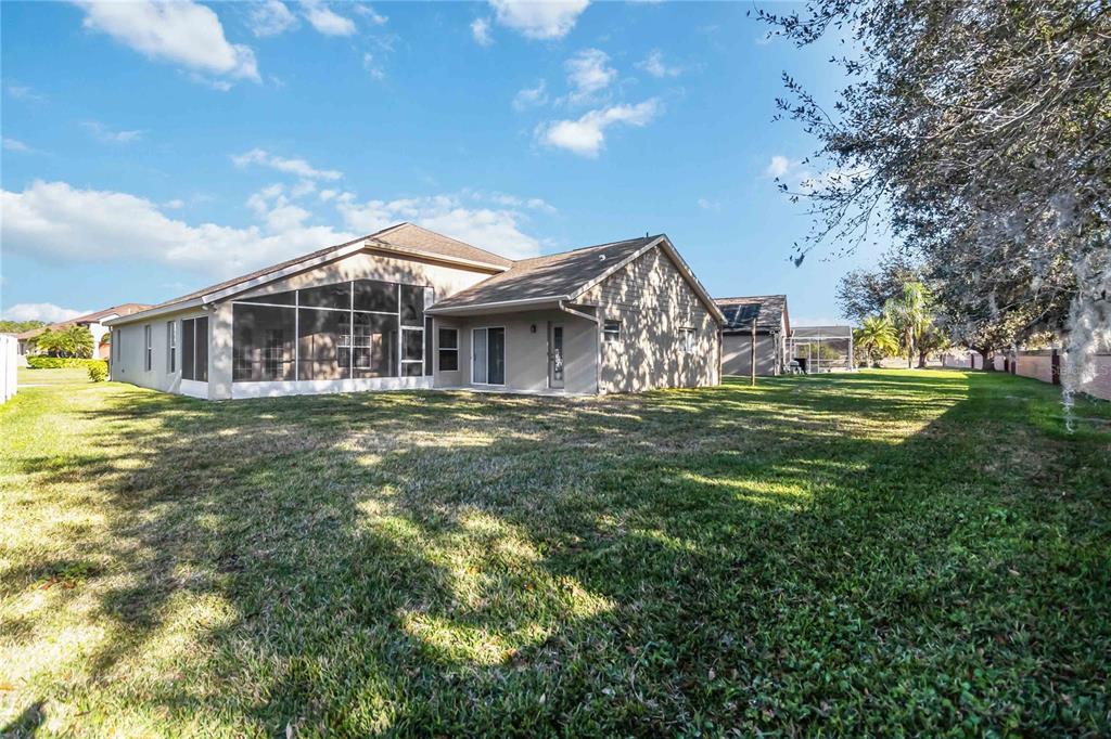 4136 Maidu Court St. Cloud, FL 34772 - Photo 32 of 40 a front view of a house with a yard