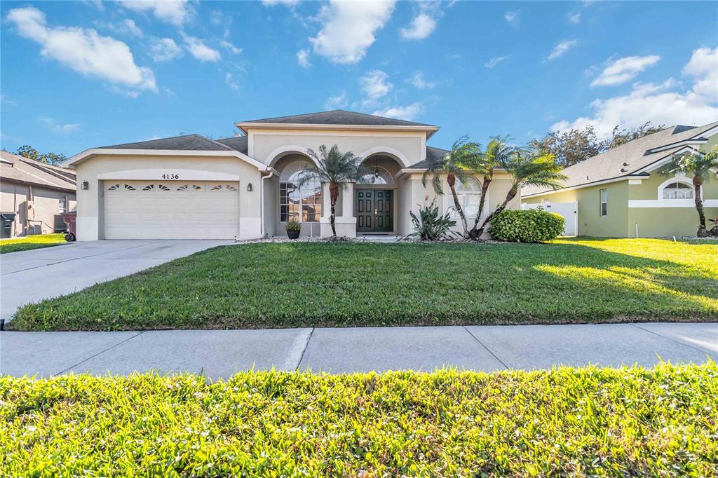 4136 Maidu Court St. Cloud, FL 34772 - Photo 37 of 40 a view of a house with a yard