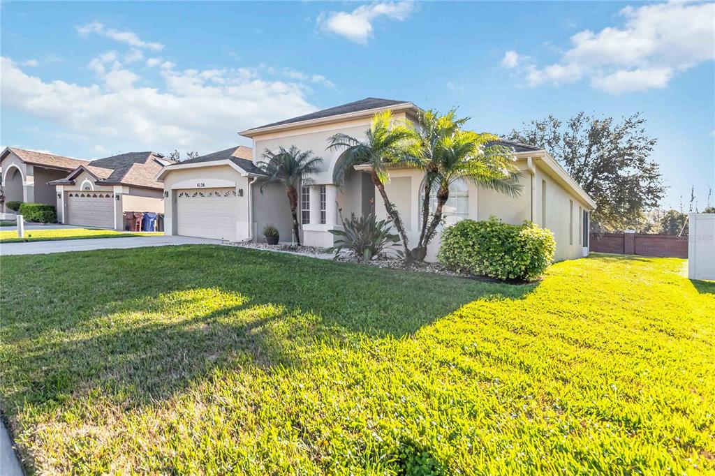 4136 Maidu Court St. Cloud, FL 34772 - Photo 39 of 40 a front view of a house with garden