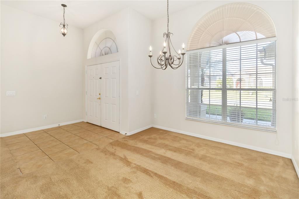 4136 Maidu Court St. Cloud, FL 34772 - Photo 7 of 40 a view of an empty room with a chandelier